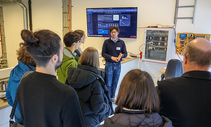 Michael Penk in the laboratory's “brain” with central control cabinet and monitor for all measurement data